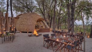 guest-area-with-cosy-fireplace-at-andBeyond-sandibe-on-a-luxury-botswana-safari-overlooking-the-okavango-delta