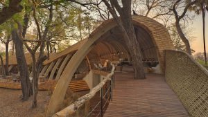 serene-architectural-design-Dining-at-andBeyond-sandibe-on-a-luxury-botswana-safari-overlooking-the-okavango-delta